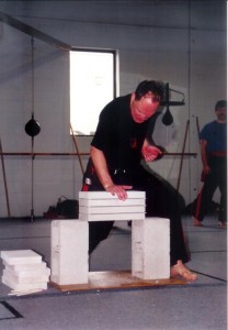 Sifu Eric Kraushaar breaking concrete at Waterloo Kung-Fu Academy